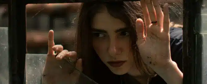 Are You Unknowingly Compromising Your Home’s Security? 4 Woman peeking through a broken window