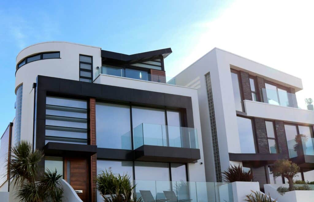 Contemporary multi-level Carrara home featuring large windows and balconies secured with Crimsafe security screens, delivering strong, unobtrusive protection while preserving modern architectural design.